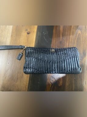 Coach Black Leather Wristlet with Gold Hardware Charm. This bag is 🔥🔥